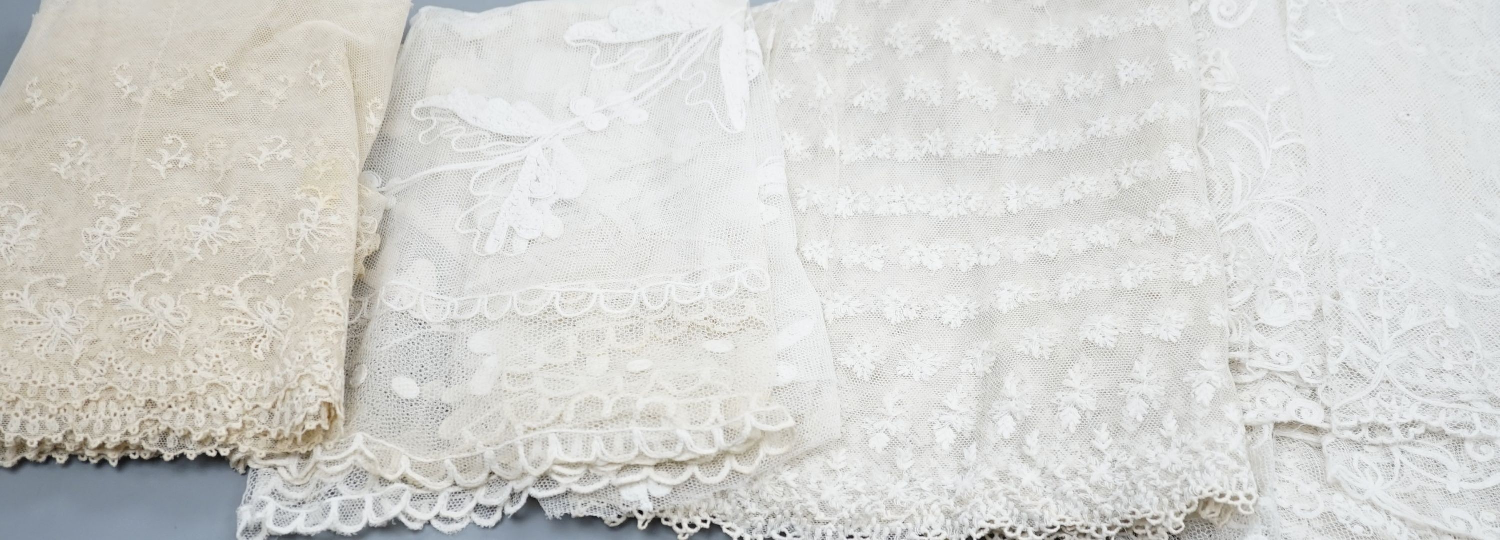 A needle lace skirt panel, a similar stole, various machine laces and trimmings